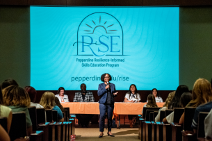 La Shonda Coleman, associate vice president at Pepperdine University, speaks in Elkins Auditorium to students for a RISE event.